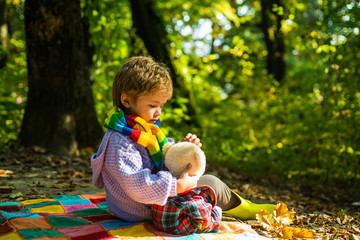 Hiking with favorite toy. I will show you beauty of nature. Inseparable with toy. Boy cute child play with teddy bear forest background. Child took favorite toy to nature. Picnic with teddy bear