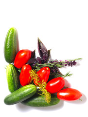 Corner from the tomatoes, cucumbers and spices isolated on the white background