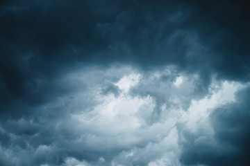 Dramatic cloudscape texture. Dark heavy thunderstorm clouds before rain. Overcast rainy bad weather. Storm warning. Natural blue background of cumulonimbus. Nature backdrop of stormy cloudy sky.