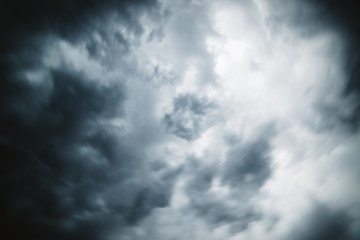 Dramatic cloudscape texture. Dark heavy thunderstorm clouds before rain. Overcast rainy bad weather. Storm warning. Natural gray background of cumulonimbus. Nature backdrop of stormy cloudy sky.