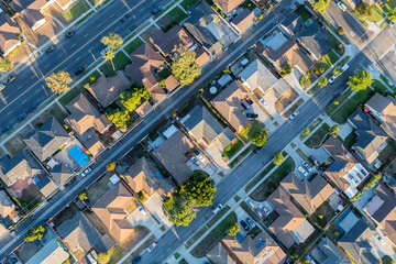 Aerial view of residential rooftops, streets and alleys in the Southbay area of Los Angeles County...