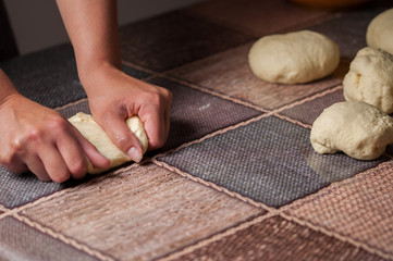 Woman making dought.Dought for pizza and bread.Food