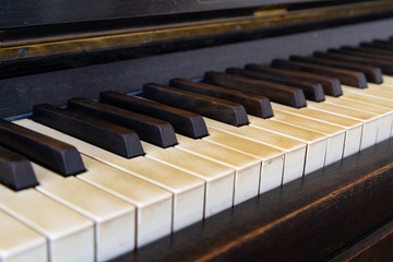 Fototapeta na wymiar An old piano. A close-up on the keys.