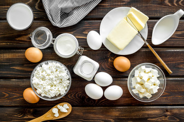 Breakfast on farm with dairy products on wooden background top view