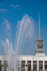 station building on the background of the fountain on a sunny summer day