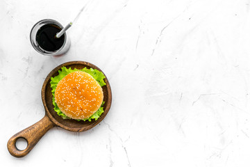 Burger and drink for national american kitchen concept on white background top view mock up