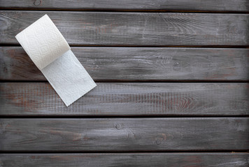 Proctology concept with toilet paper on wooden background top view mock-up