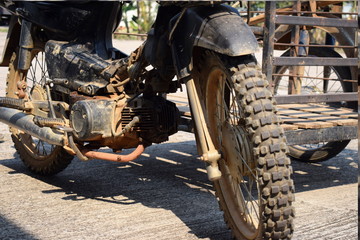 Old motorcycles, damaged engines, waiting for repairs