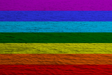 The rainbow flag, the symbol of the international movement for peace on silk, seven colors, located...