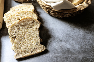 Organic Homemade Ancient Grain Bread made on dark background with copy space