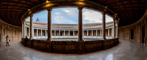 The Palace of Charles V is a Renaissance building in Granada, southern Spain, located on the top of...