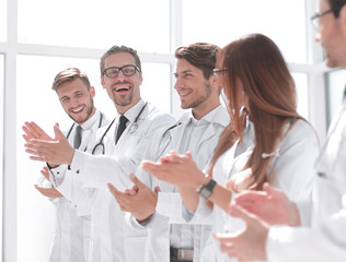 group of successful doctors applauds