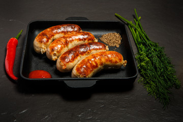 square pan with sausages, ketchup, caraway, dill and chili pepper