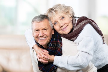 Portrait of happy senior couple smiling at home