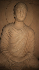 Fototapeta Statue of the Buddha at Jaulian ruined Buddhist monastery, Haripur, near Taxila, Pakistan. A UNESCO World Heritage Site, dating from the second century CE. obraz