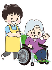 介護士の男性と車椅子の高齢女性