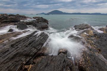 Sea dawn with waves and rocks at nha trang