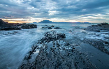 Sea dawn with waves and rocks at nha trang