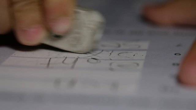 closeup hand writing paper, education concept