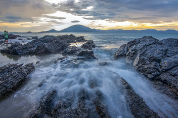 Sea dawn with waves and rocks at nha trang
