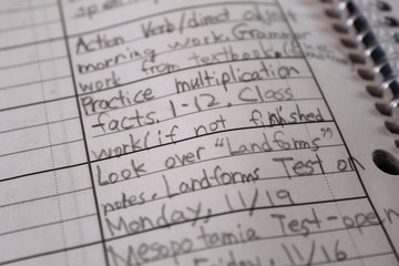 Assignment notebook, homework list written by child