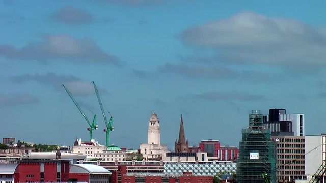 Time Lapse of Leeds City Centre Skyline including Parkinson Building, Leeds Town Hall & Cranes during Summer&rsquo;s Day with Blue Sky & White Clouds