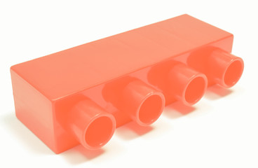 Fototapeta premium Red toy block for children on white background.