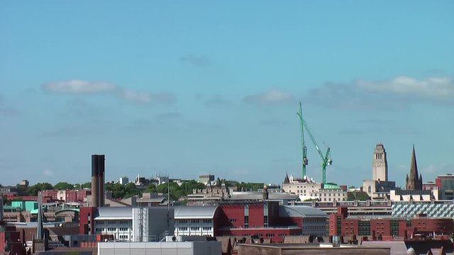 Wide Time Lapse of Leeds City Centre Skyline including Parkinson Building, Leeds Town Hall & Cranes during Summer&rsquo;s Day with Blue Sky & White Clouds