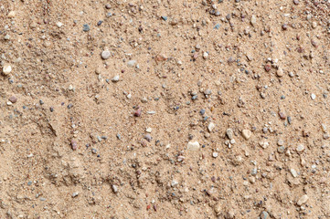 sandy background: rough construction sand surface, small stones