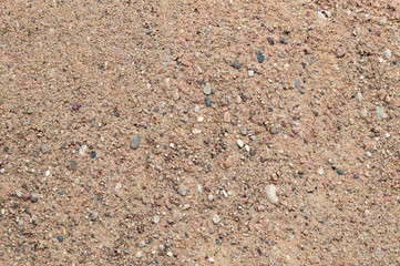 sandy background: rough construction sand surface, small stones