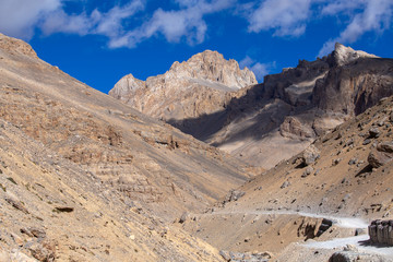 Fototapeta na wymiar Himalayan mountain landscape along Leh to Manali highway. Winding road and rocky mountains in Indian Himalayas, India