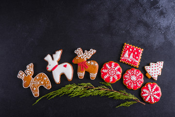 Christmas homemade gingerbread cookies on a dark background