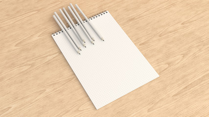 Notebook with white pencils