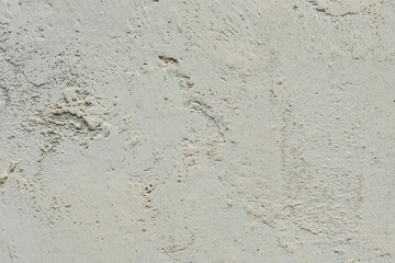 Texture of a concrete wall with cracks and scratches which can be used as a background