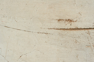 Texture of a concrete wall with cracks and scratches which can be used as a background