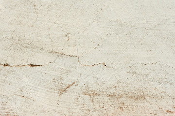 Texture of a concrete wall with cracks and scratches which can be used as a background
