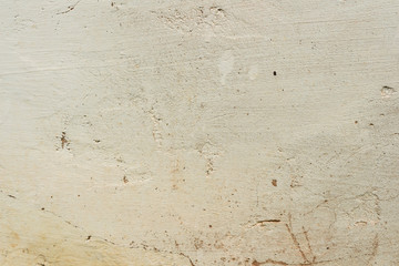 Texture of a concrete wall with cracks and scratches which can be used as a background