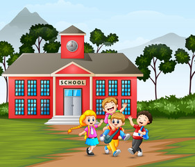Obraz na płótnie Canvas Happy children in front of the school