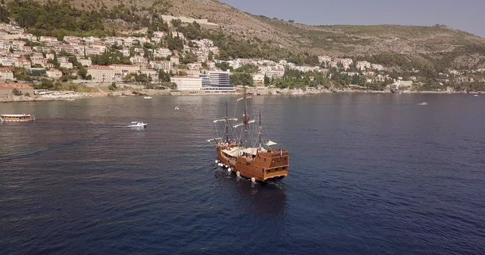 AERIAL: Old boat cruising in Dubrovnik, Croatia