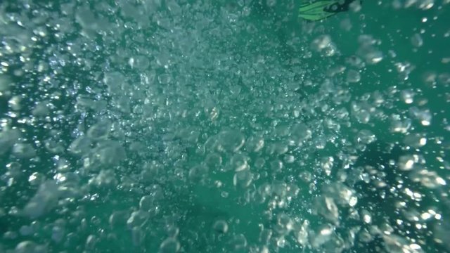 Divers bubbles underwater drowning last breath slow motion.