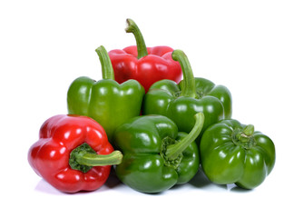 Green and red pepper on white background