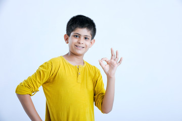 young indian boy showing fingers