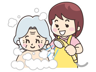 高齢女性に入浴介助を行う介護士の女性