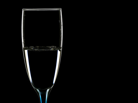 Elegant picture of glasses with clear water on a black background