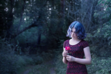 girl with blue hair in night forest