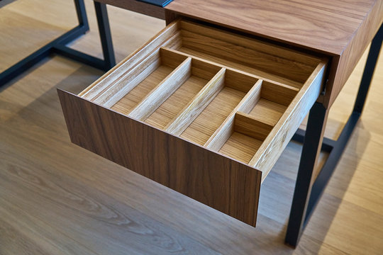 Open Drawer Of Wooden Table In Office