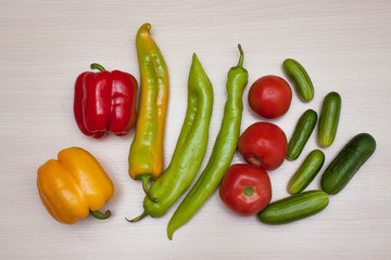  Healthy food, including various vegetables, on a light wooden background, top view, horizontal.