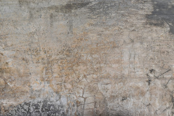 Grunge concrete wall with crack and stains in industrial building. Cement texture for design and background.