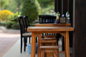 Fototapeta na wymiar Wooden table in noodle shop in Thailand