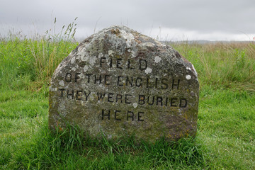 A stone marker reading FIELD OF THE ENGLISH - THEY WERE BURIED HERE indicates the spot where British troop casualties may have buried following the 1746 Battle of Culloden in Scotland.